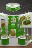 Placeholder: Corner green exhibition stand of a food company with product displays and a meeting area