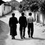 Placeholder: People in 1995 walking on a street in a village, black and white, very odd