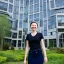 Placeholder: A short haired, female software engineer taking a selfie in front of Building 92 at Microsoft in Redmond, Washington