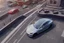 Placeholder: A Tesla 'Model S' is drifting at high speeds, on the streets of San Francisco. (CINEMATIC, WIDE ANGLE LENS, PHOTO REAL)