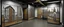 Placeholder: A gray factory with doors designed in Navajo woven art painted by Pieter Bruegel the Elder