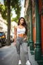 Placeholder: full body shot Young woman, 20 years old, wearing nice tight pant and top sporting in street,looking to camera