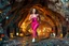 Placeholder: make a video pretty crystal cave covered with jewells and CIFI jewell lights and miniature city buildings and miniature people and streets, a beautiful fashion model lady with cute,curvy hair,makeup, in pretty sports suit is running inside cave ,dynamic camera fallow her inside cave capturing full body, dynamic lights.