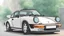 Placeholder: a 1990 Porsche 911, Ghibli style anime