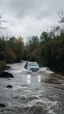 Placeholder: A car in the rage flooding river