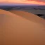 Placeholder: désert du Sahara, coucher de soleil, dune de sable, montagne, rochers