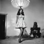 Placeholder: [high res photo by Russ Meyer] the bottom of her dress is a Lampshade, light from inside, view from below [spanish fiesta]