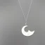 Placeholder: polyester necklace with a silver pendant in the shape of a crescent moon