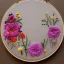 Placeholder: embroidery hoop with delicate arrangement of pressed flowers, pressed flowers, tulle, couture, beautiful composition, aesthetic layout, wildflowers, detailed beadwork, beading