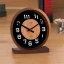 Placeholder: Dark wood table clock future modern