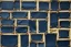 Placeholder: canvas background covered with a grid of many rectangular weathered navy blue leather patches that are each stitched (brown) and nailed (brass) around the edges