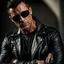 Placeholder: Handsome and muscular 40 year old Biker wearing a leather jacket and dark sunglasses standing with his arms folded