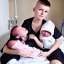 Placeholder: Russian tomboy boyish boylike short man's haircut boyish features in black girlish nightgown in hospital with newborn baby