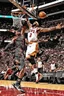 Placeholder: lebron james passing the ball to dwayne wade and dunking violently on michael jodrdan