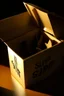 Placeholder: The fingertips of a clawed hand emerging from the top flaps of a cardboard box, the word "surprise" handwritten on the front surface. The box is in a darkened storeroom with a single light source from an ajar door.