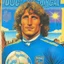 Placeholder: A 1980 medieval london comic cover of uruguayan sky-blue football magazine. At the street city, Manhattan. Diego Forlan detective.