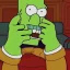 Placeholder: evil retired green man who is retired and green who is sitting on the simpsons couch has a large nose and is holding a duff beer in feet