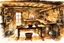 Placeholder: ink wash and watercolor illustration of the interior of an 18th century rough hewn New England cabin, with a dry laid stone hearth , rustic furniture , kitchen utensils, hanging herbs , curing game meat, in the comic book style of Bill Sienkiewicz and Jean Giraud Moebius , sharp focus, natural light and shadow, rich earth tone colors