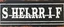 Placeholder: fill composition with large and wide hand painted old western sign that reads: "SHERRIF" white on black with inset white stripe aged paint sanserif