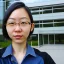 Placeholder: A short haired, Japanese female software engineer from MIT taking a selfie in front of Building 92 at Microsoft in Redmond, Washington