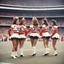 Placeholder: [vintage style scratches glitches] 1970s Cheerleaders in the stadium