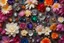 Placeholder: top view of lot of coloured flowers and gemstones in candlelight