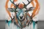 Placeholder: A realistic tattoo of a stag. Create contrast using the colours black, turquoise and orange also use the colour: #5E8AC3.