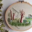 Placeholder: exquisite whimsical woodland in embroidery hoop, intricate, highly detailed, linen and wood backdrop