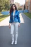 Placeholder: full body of very beautiful girl with pants and blouse and jacket , curvy hair ,standing idle pose in studio pretty makeup,perfect face,sport shoes