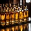 Placeholder: photography of several whiskey bottles from an upward angle inside a mirrored box. golden lights and reflections.