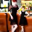 Placeholder: Russian guy young mommy boyish boylike short man's haircut men's face boyish features in black girlish lacy cocktail dress as mother in restaurant