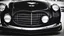 Placeholder: Photograph of a the front grill of a gorgeous, expensive, oldschool black sports car with a big, black front grill, realistic, stylish, taken up close from the front of the car.