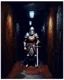 Placeholder: A frightening castle dungeon hallway with an knight warrior in rusty chainmail holding a zweihander painterly rpg art