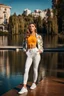 Placeholder: fullbody shot of young-beautiful-girl-with-a-perfect-face-with-make-up-wearing- sport pants and jacket standing ,nice nature in modern city scape environment ,wild flowers,clean water in nice pool