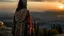 Placeholder: A Palestinian woman wearing an embroidered dress with the city of Jerusalem behind her during a winter sunset