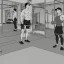 Placeholder: man with muscles doing fitness in a fitness studio, standing in front of a mirror, black and white only, lots of details