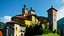 Placeholder: Huge medieval monastery at the top of a hill in northern Italy