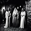Placeholder: three sorceresses [high res photo of three women by Helmut Newton] in the flickering torchlight of the medieval tavern, three enchanting sorceresses stood side by side, their mystical auras shimmering with an otherworldly allure. Clad in flowing robes that accentuated their every movement, they exuded an air of command that silenced the rowdy patrons. Each of them possessed an undeniable presence, their gazes cutting through the haze of smoke and ale, demanding respect.