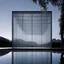 Placeholder: Ethereal glass structure suspended over a serene body of water, showcasing the innovative architectural style of Renzo Piano, captured by Hiroshi Sugimoto