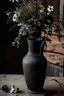 Placeholder: detail image of an old black rustic vase with flowers on a wooden table. modern farmhouse style with rustic feeling.