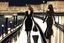 Placeholder: two elegant women walking at night on a sea promenade, by artist "Ingrid Umber", by artist "Sienna Lamberts