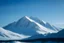 Placeholder: view of a snow-capped mountain with a clear blue sky in Alaska. Browse stock and royalty-free videos, hasselblad h6d-400c style, Elizabeth Gadd, layered textures, shapes, minimalist landscapes, minimalist photography, Gediminas Prankevicius, atmospheric perspectives --ar 4:3 --v 5