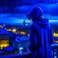 Placeholder: girl in a raincoat, watching the empty city, at midnight, dark blue colours, rainy, atmospheric, photo quality