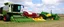 Placeholder: Parked at the edge of a field is a Claas brand Combine(left)seeder(middle) and a John Deere Tractor with seeder(right) simplified