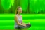 Placeholder: "A person smiles and feels contentment and serenity while practicing meditation in nature. They may be sitting on the grass or by a tranquil lake, placing their hands on their knees, and blissfully closing their eyes 4K