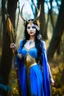 Placeholder: A picture of a beautiful blue faced Korean goddess with skin painted blue, blue body, blue torso, wild black hair, stag antlers, elven ears, golden skirt, holding a staff in a sunny forrest