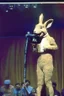 Placeholder: 1990 human show the winner is a "half human rabbit combined animal::40", realistic (film Color Mission 200::10) photo from old disposable camera , he brings on a friend with a microphone,grainy photo