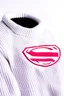 Placeholder: Superman's Balenciaga sweater Winter elegant inspired by Superman's emblem design white tones with dual color on a white background, product catalog photography, soft spot lighting, depth of field, 4k –ar 3:5 –q 2