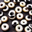 Placeholder: White and black striped donuts on a black table