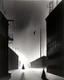 Placeholder: Dark street night figure fog odd Yves Tanguy spooky